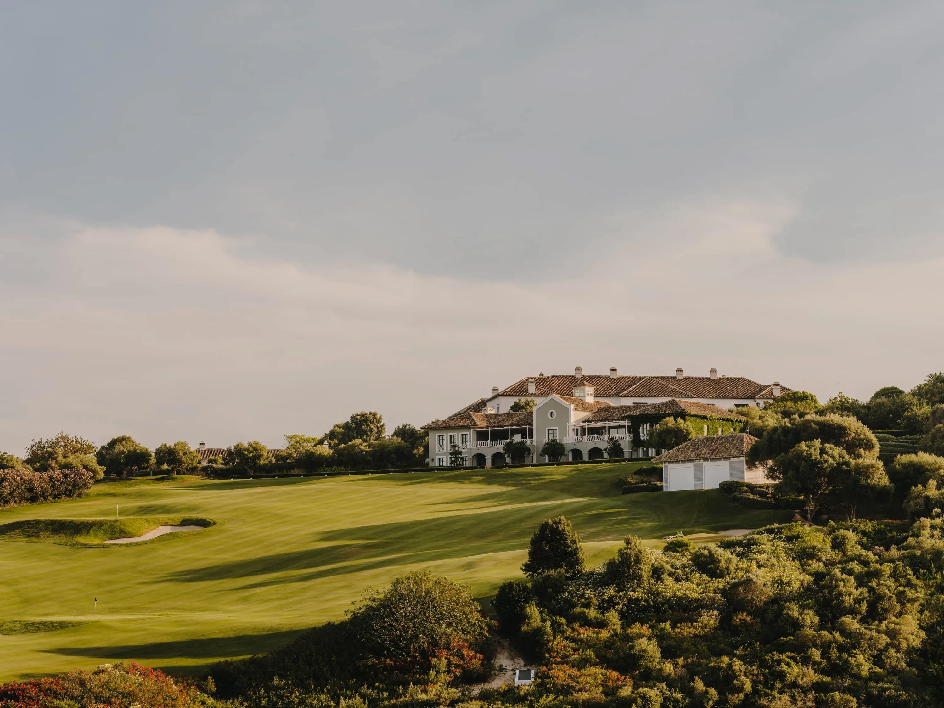 The Finca Cortesín golf course with the clubhouse on the hill